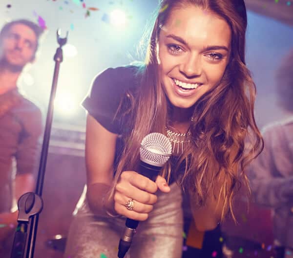 Karaoke machine hire being used by a man and woman