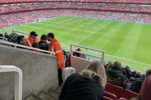 Arsenal Women’s WSL match at the Emirates Stadium during a festive December fixture, pitch view from the stands.